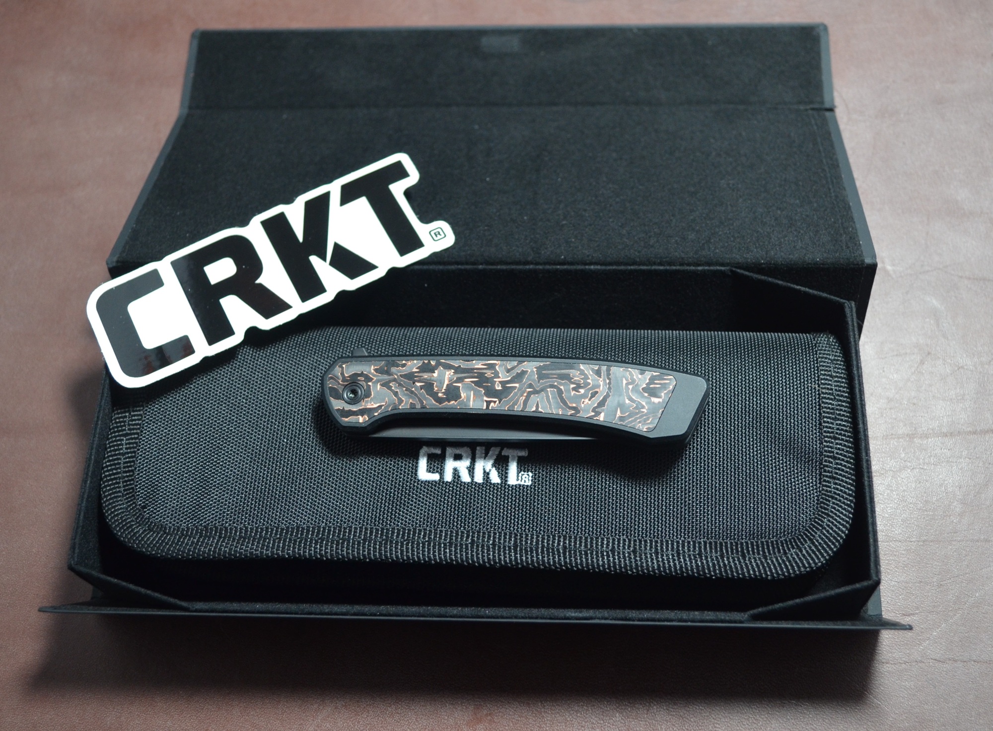 CRKT Q Compact Liner Lock folded inside its box with case and sticker