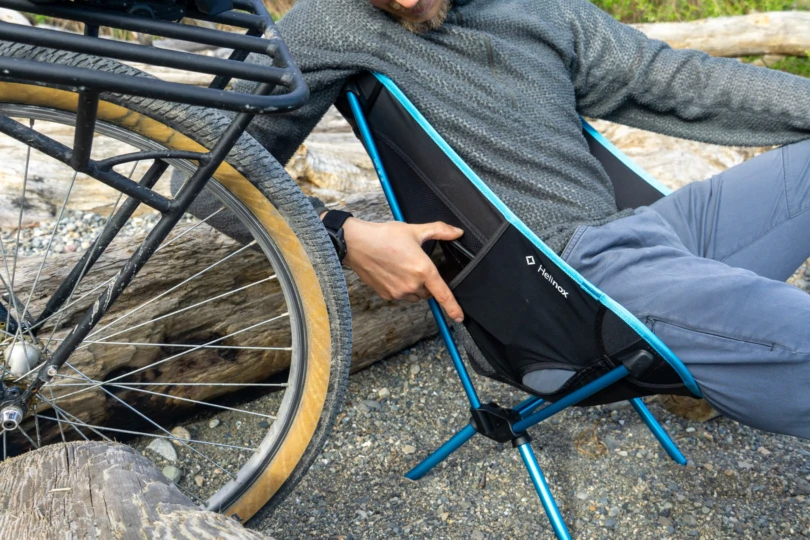 the author slides a phone into the deep stretch pocket on the helinox chair