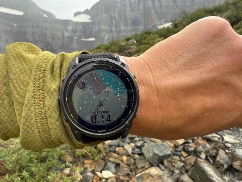 the author consults the enduro 3 watch while navigating off-trail