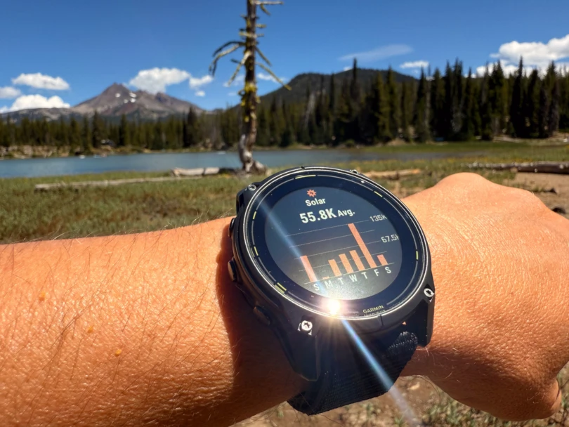 the enduro 3 watch aimed into the sun and charging, with the solar metrics watch face