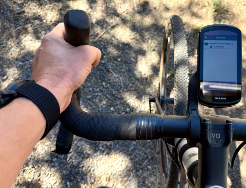 the author riding a bike and using the enduro 3 and garmin bike computer together