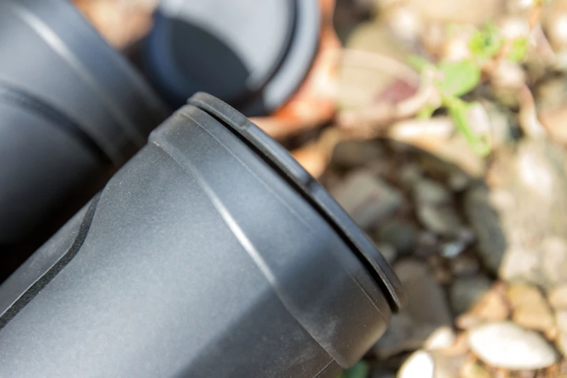 The lens cover partially on binoculars