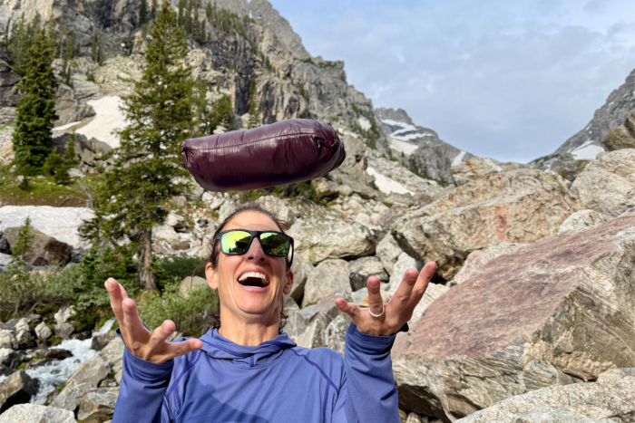 Mountain Hardwear Ghost Whisperer Hoody packed in its stuff sack tossed in the air