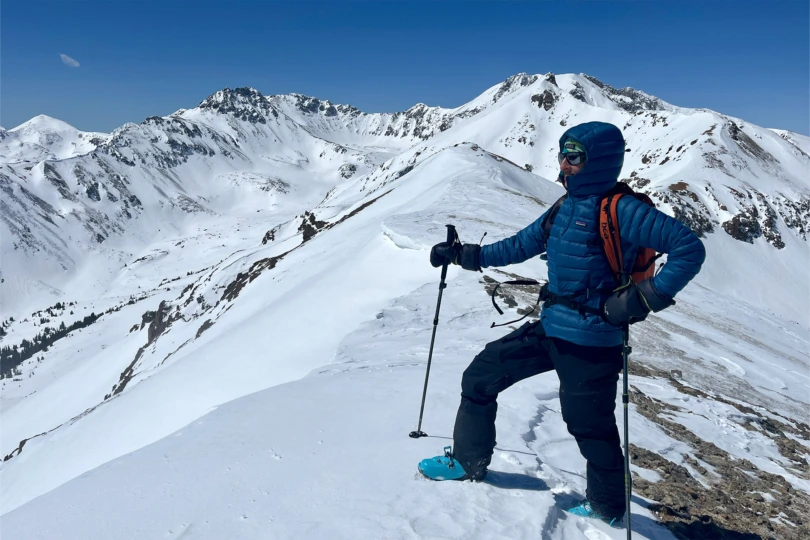Patagonia Down Sweater Hoody worn during a snowy summit climb
