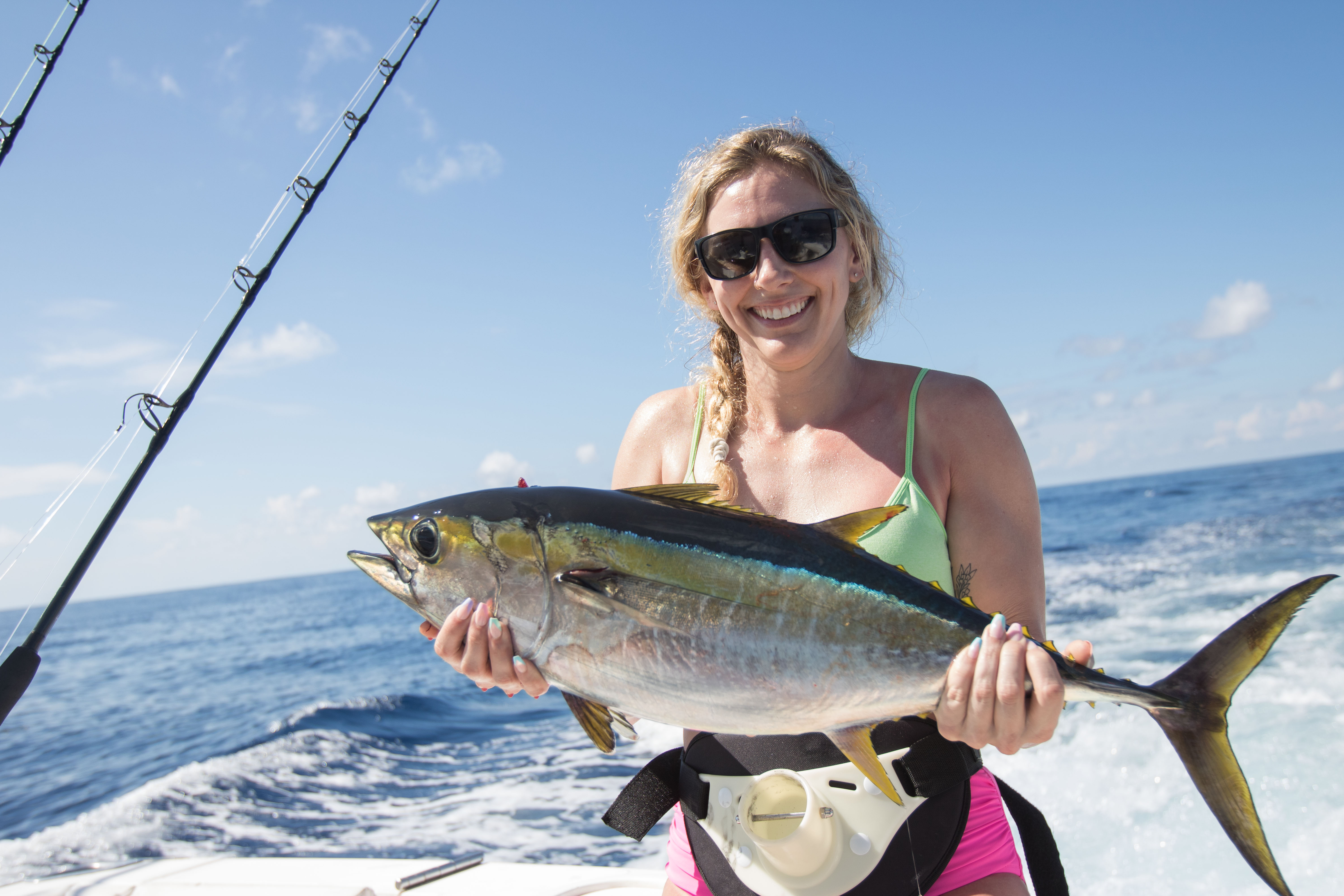 An angler holding a tuna