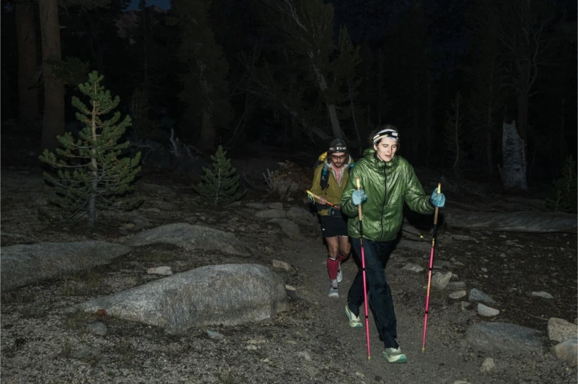 Two people trail run at night