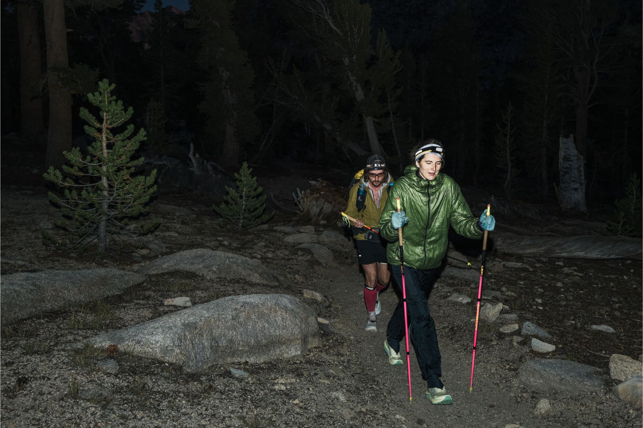 Two people trail run at night