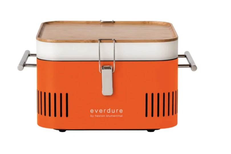 Orange travel charcoal grill