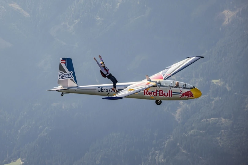 Person prepares to jump off plane and sky dive.