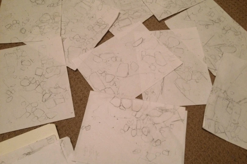series of maps on white paper