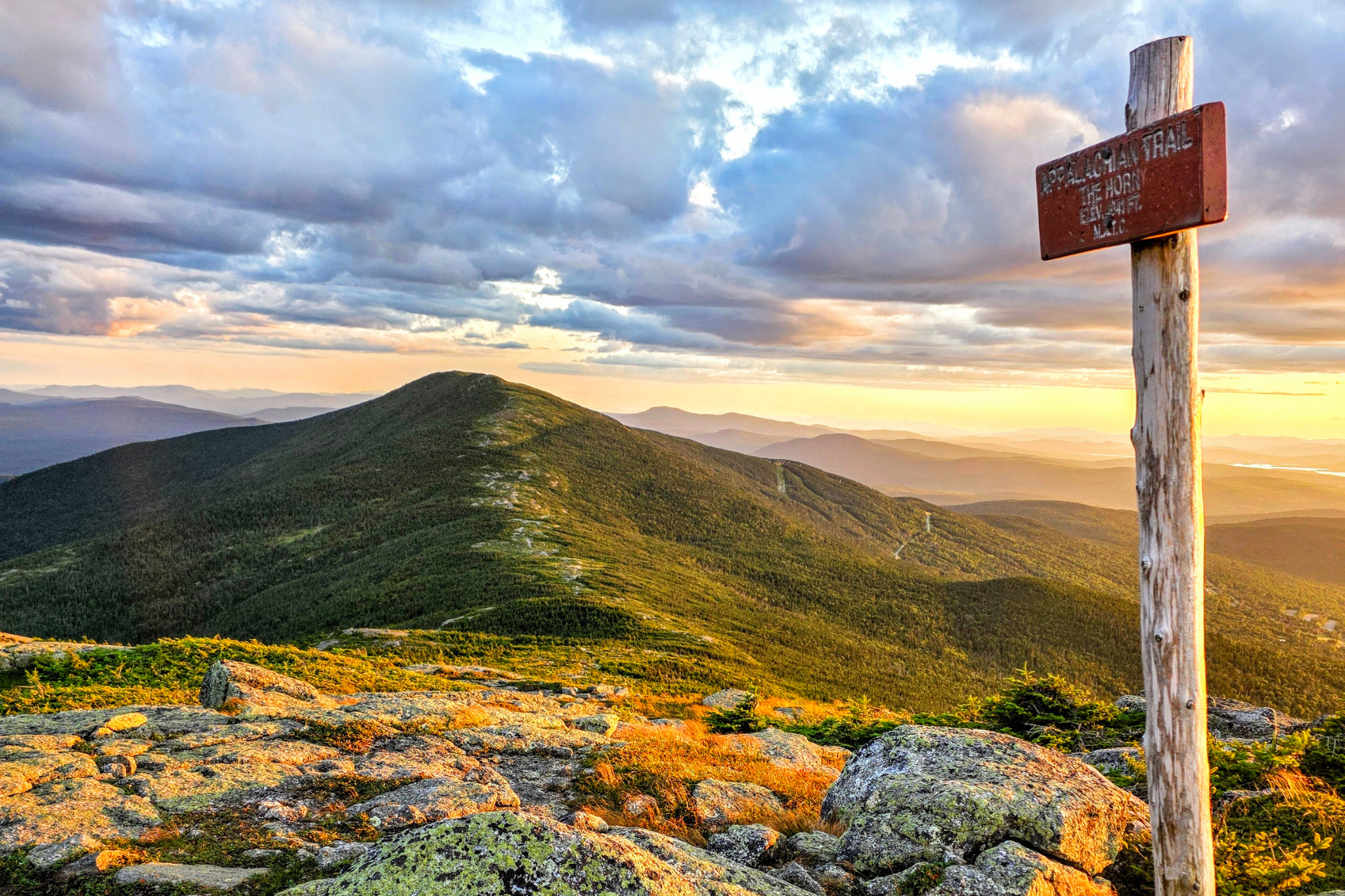 Mountain with trail sign