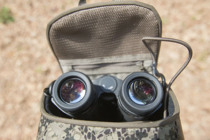 The ZEISS SFL 10X50 binoculars stowed in a bino harness