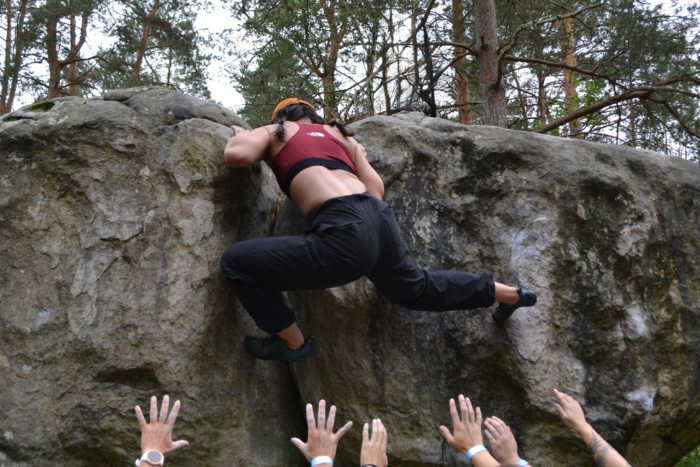 woman bouldering in fontainebleau france