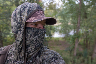 A hunter with the facemask and hood of the Badlands Stealth CoolTouch Hoody on