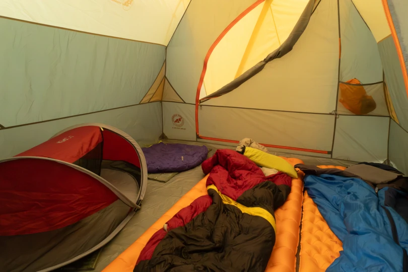 The tent interior filled with sleeping bags and pads after setup