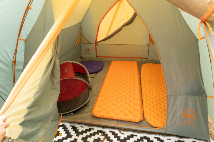 Inside view showing sleeping pads and a small child tent