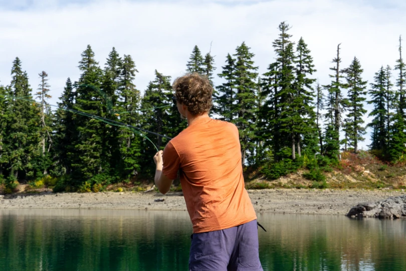 the author makes a fly cast in the ibex tee shirt