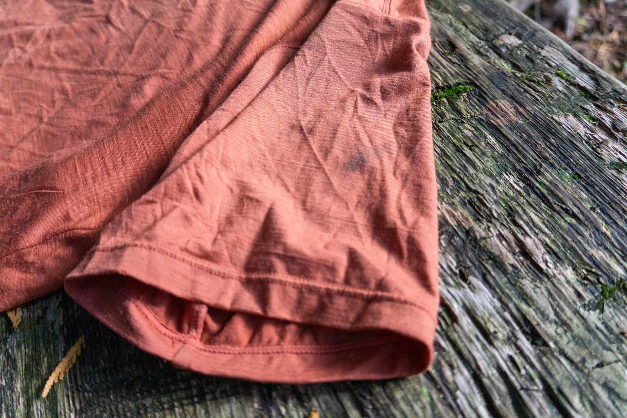 the sleeve of the ibex naturalist tee with a slight oil stain on it