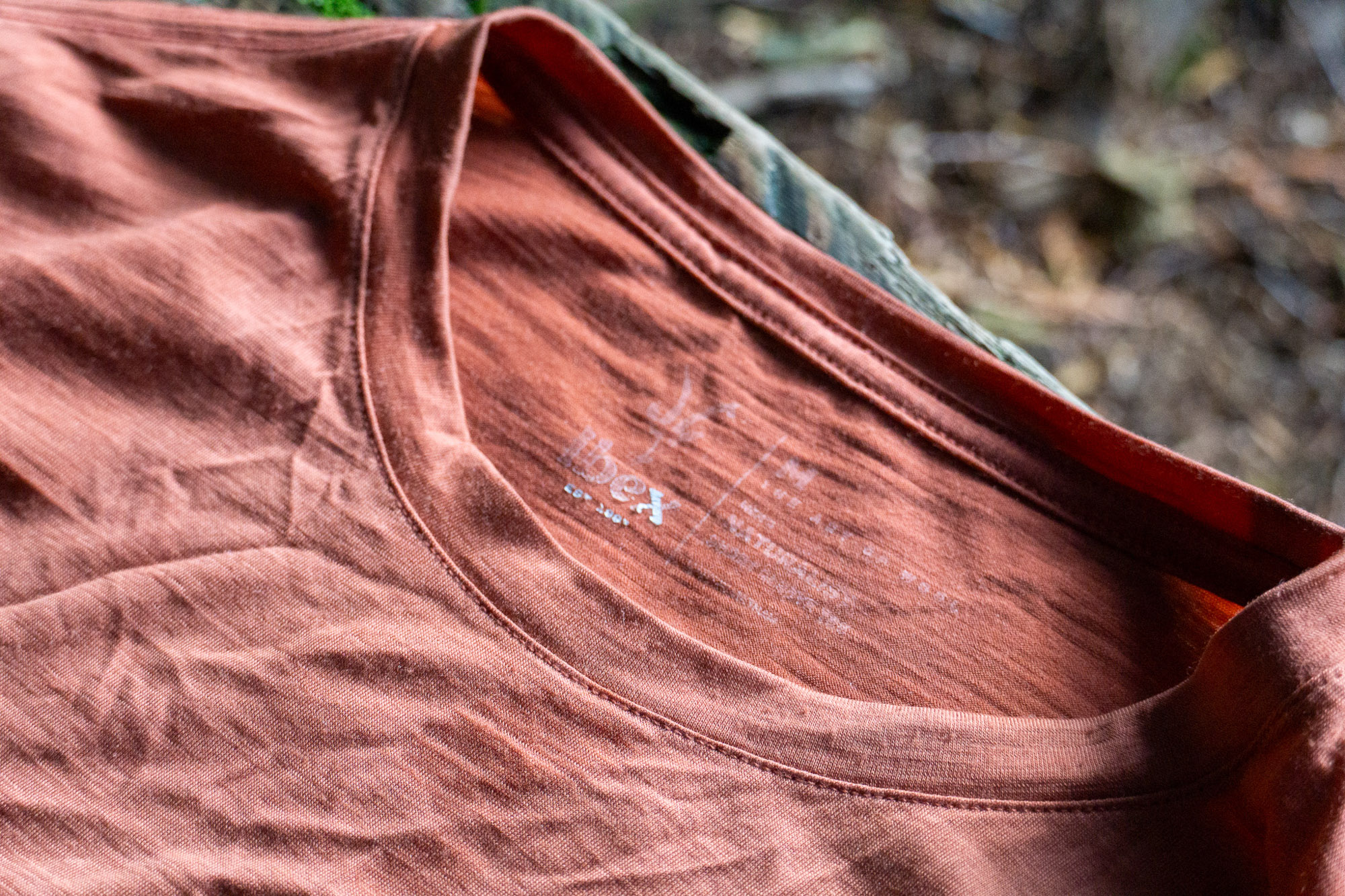 the screenprinted logo on the ibex tee shirt looking worn