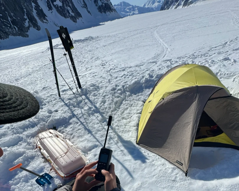 the author makes a satellite phone call in the ruth gorge