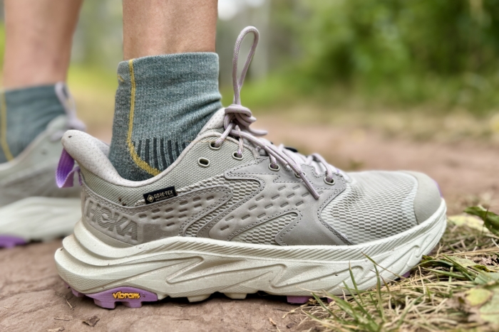 Woman wearing the Hoka Anacapa Low GTX hiking shoes on a hike