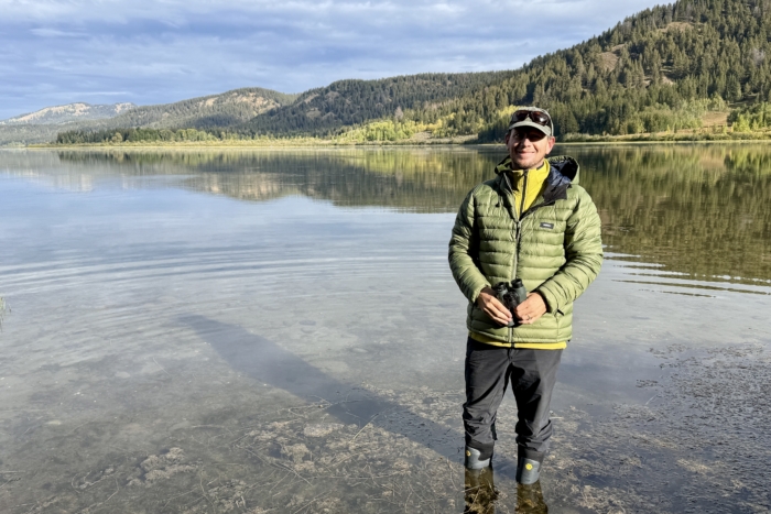 Man wearing the Mountain Hardwear Polartec Power Grid Full Zip as a midlayer