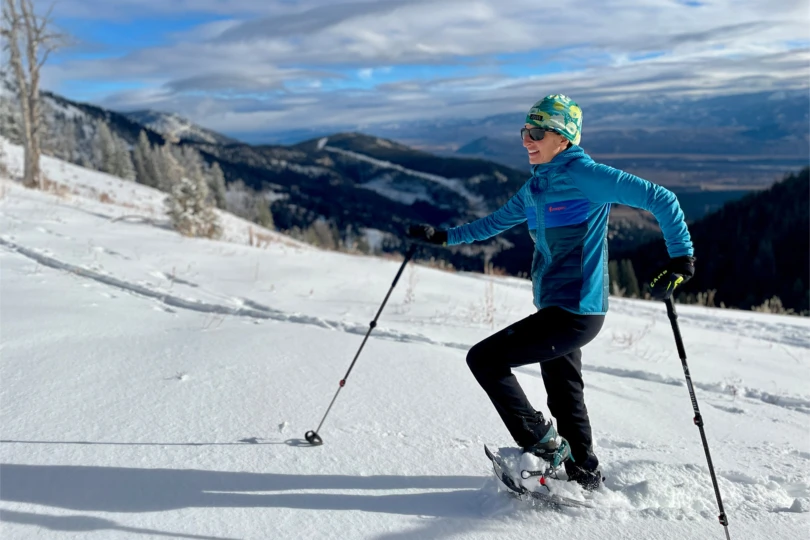 The MSR snowshoes stride across a sunny mountain slope