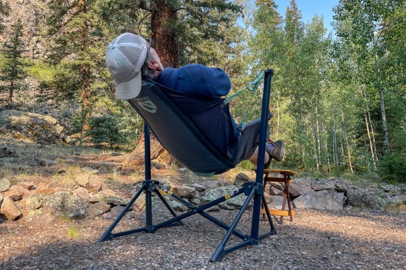 a camper sits back in the nemo stargaze evo-x camp chair