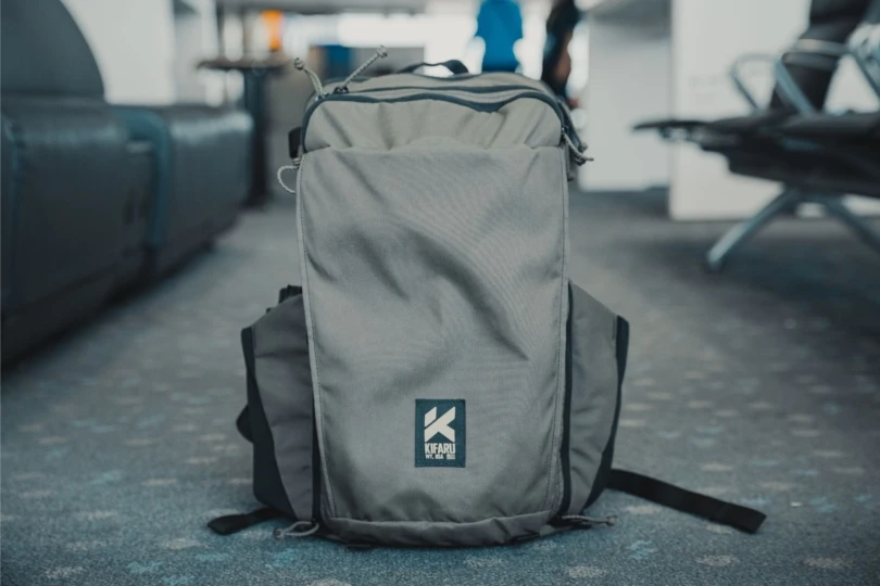 Gray backpack on ground in airport