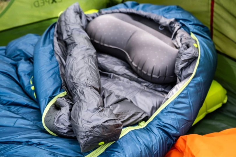 Unzipped sleeping bag in tent