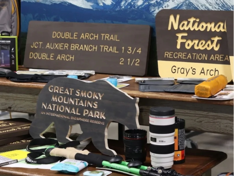 Outdoor gear shop display with signs and camera