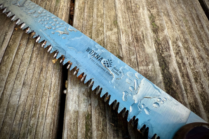 Wet Woxna Ljusnan 10” Folding Saw blade with visible water droplets and “Made in Sweden” marking