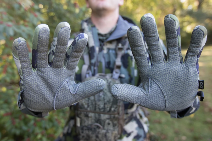 A hunter displaying the leather palms of the Kings Camo XKG Primaloft Guide Gloves