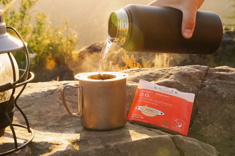 pouring coffee from thermos into coulee coffee pour over