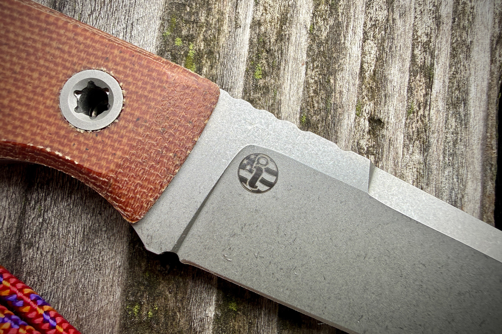 A close-up shows the knife’s handle texture and the small USA logo stamped near the blade edge