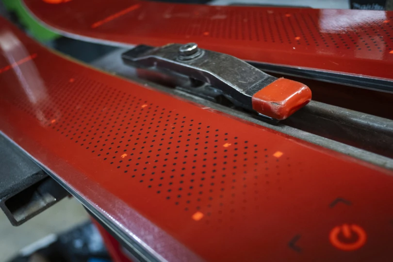 Detailed view of the Blizzard ski surface showing the top sheet texture and binding