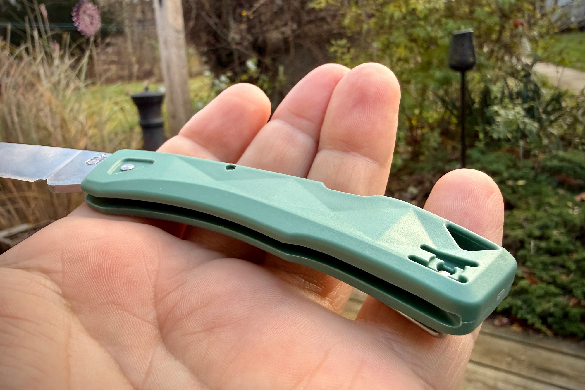 A close look at the handle of the Gerber LST Ultra resting in a person’s palm, showing its slim, lightweight shape