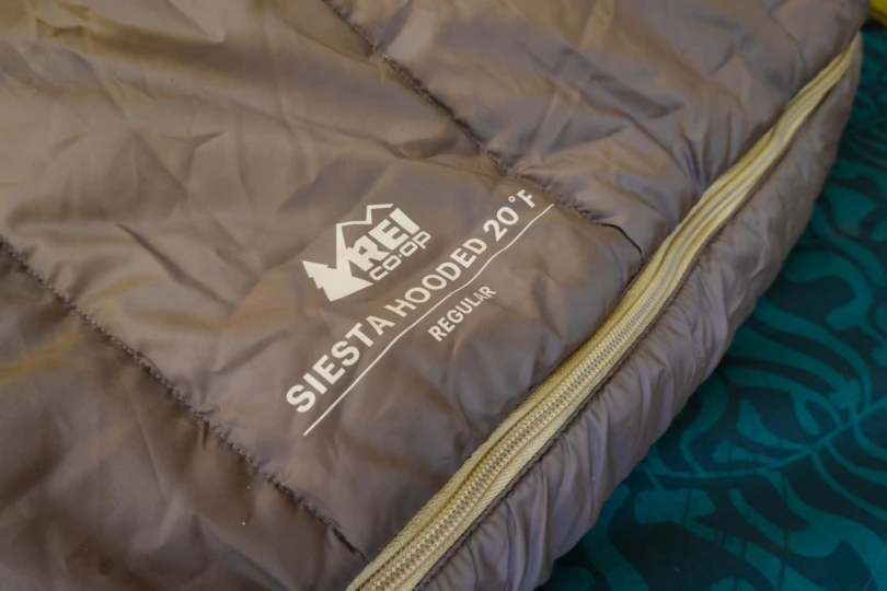 the siesta sleeping bag laid out in a tent