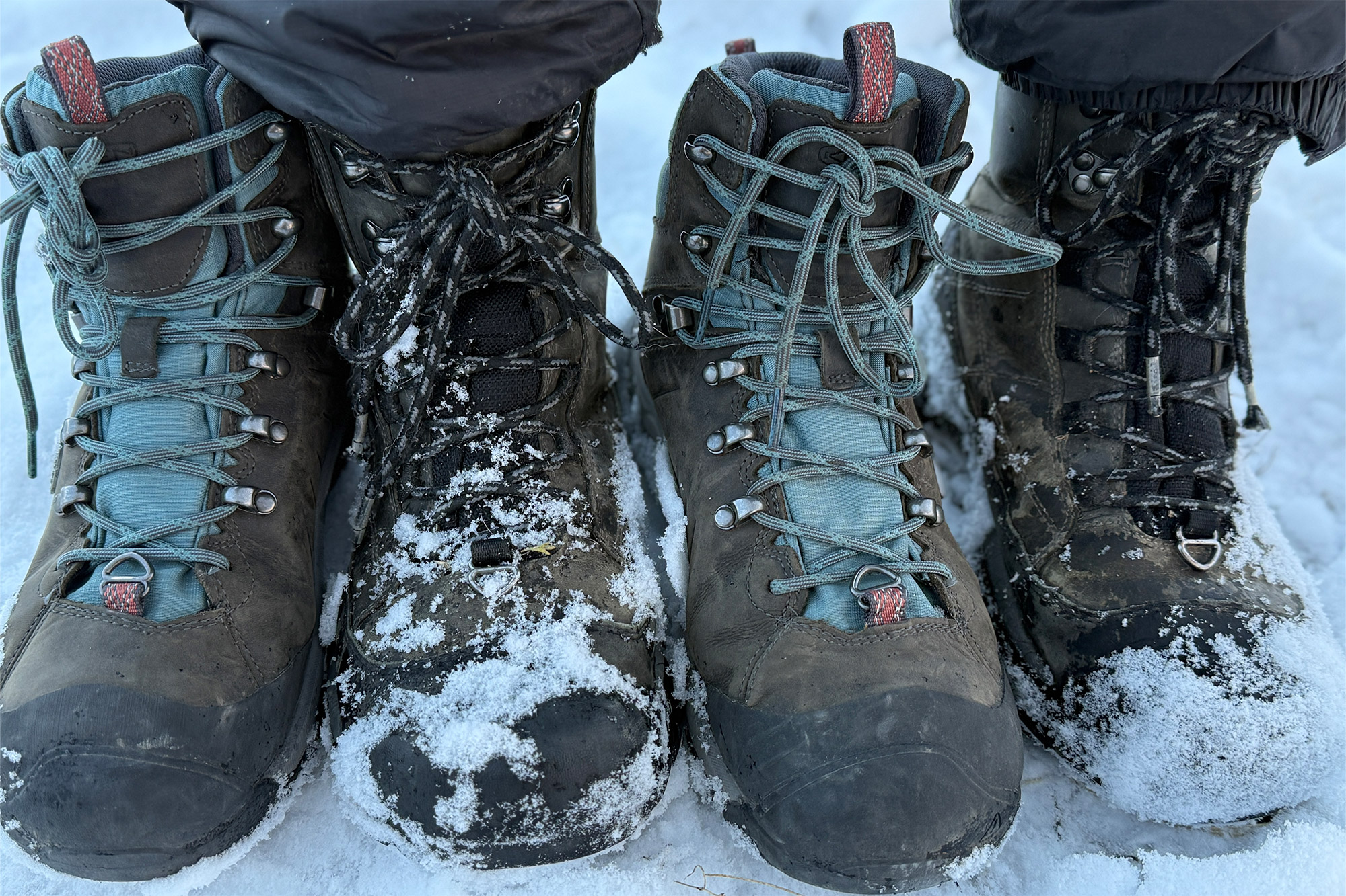 Close-up of two pairs of snow boots side by side, covered in snow — Keen Revel IV Polar