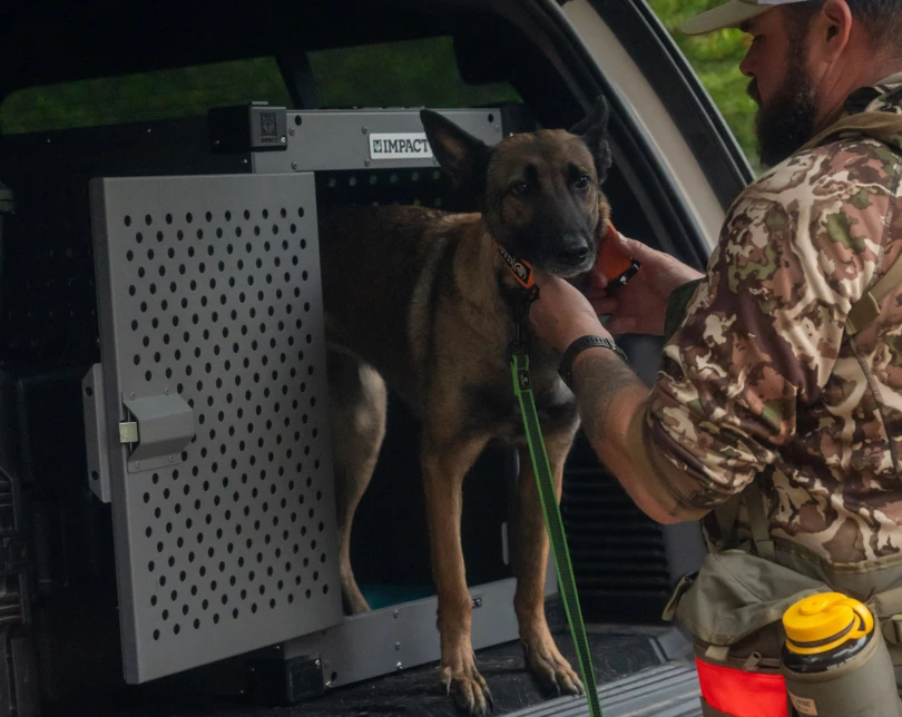Man with dog and crate