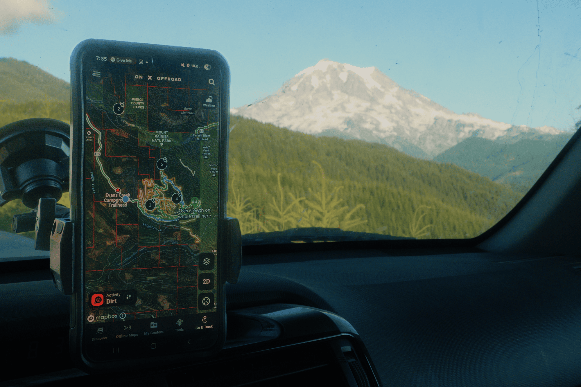 phone with onX offroad on mount in car