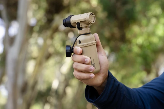 hand holding up tan air pump