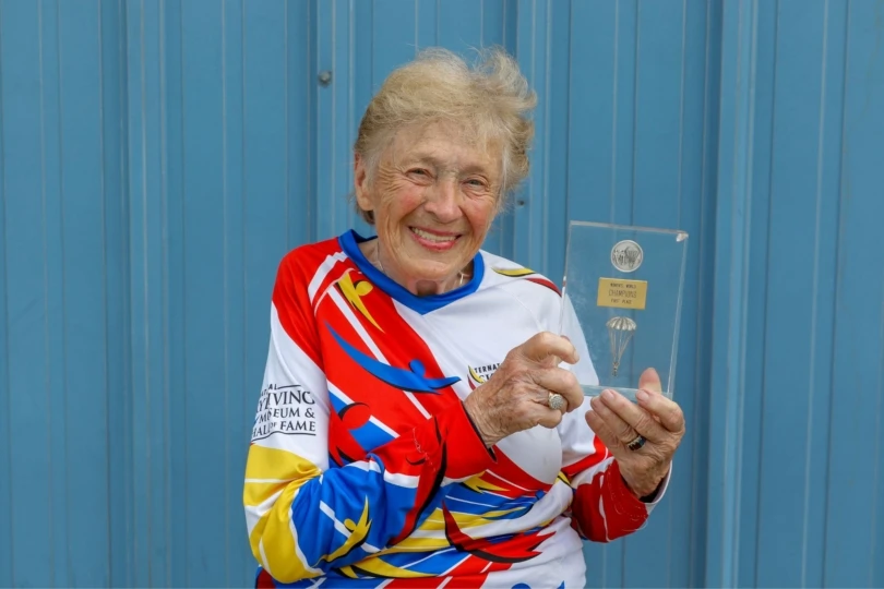 Woman poses with award