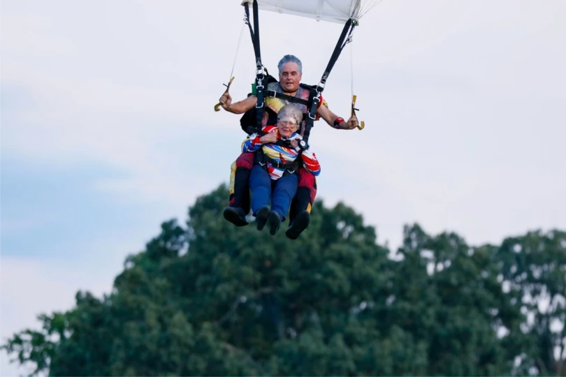 two skydivers tandem jumping prepare to land