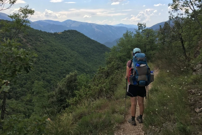 View of hiker on trail from behind