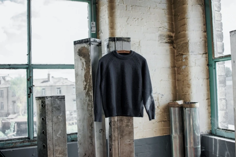 gray sweater on hanger