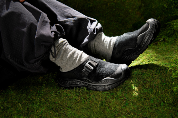close up shot of person wearing black clogs