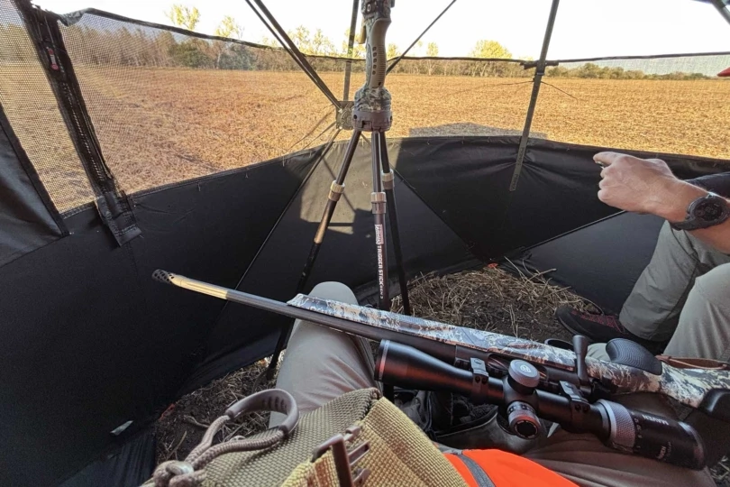 rifle in deer blind