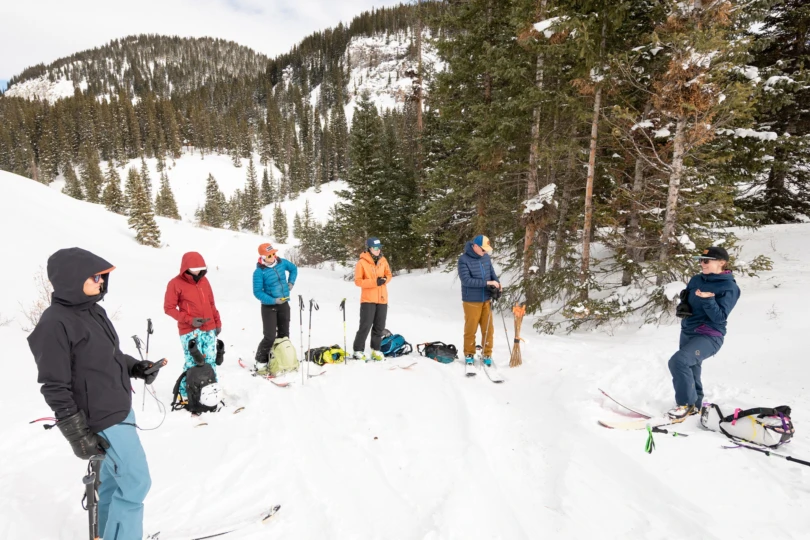 group of people in snowy mountain