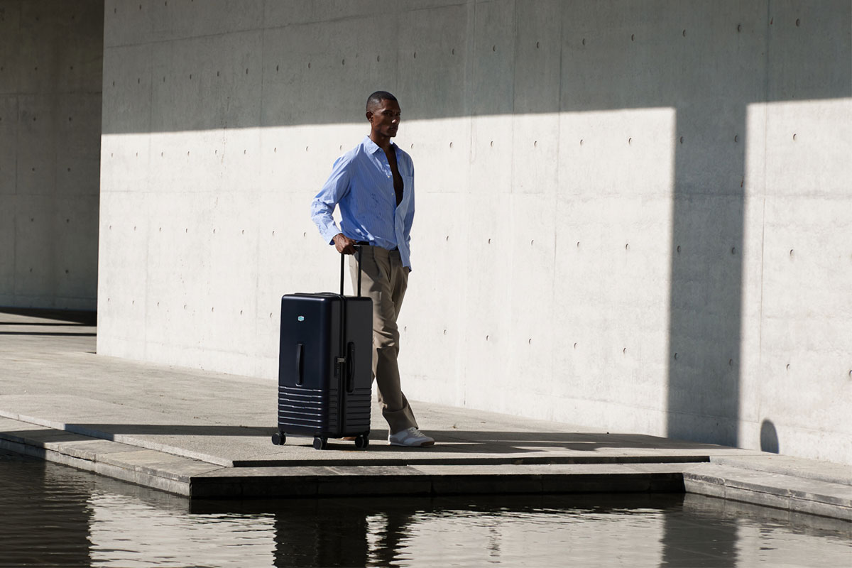 A man with a Bagsmart suitcase